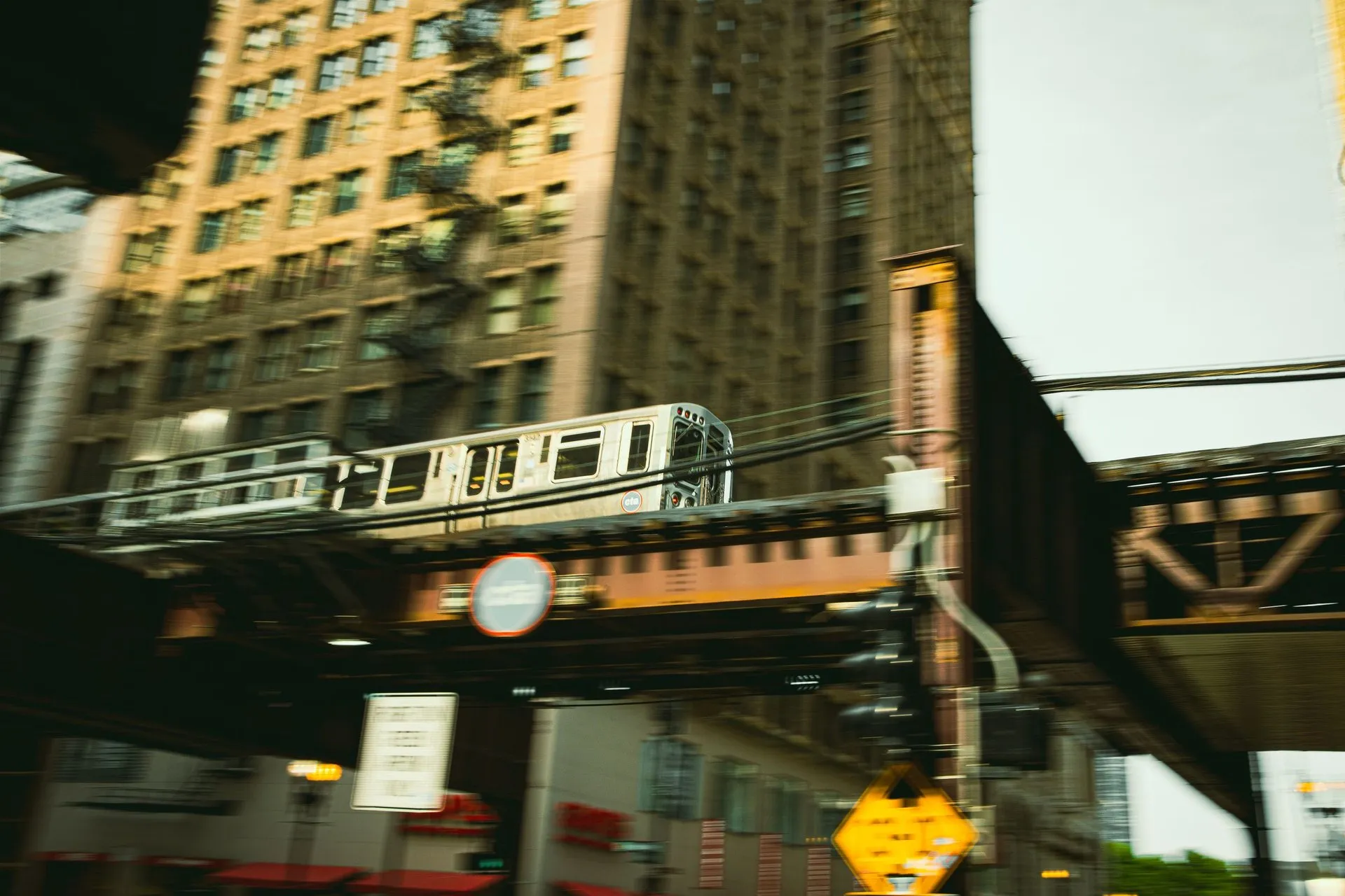 Blurred train movement in Chicago's urban landscape highlighting the