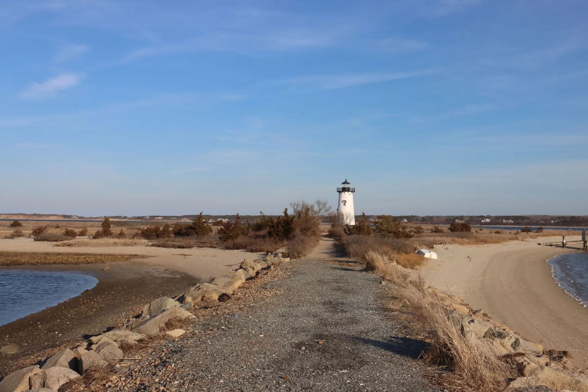 Coastal landscape featuring Edgartown Lighthouse and sandy beach on