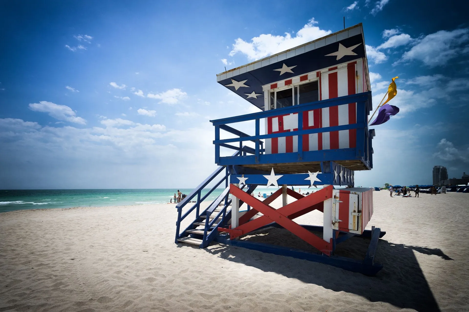 Colorful lifeguard tower with American flag design on Miami Beach