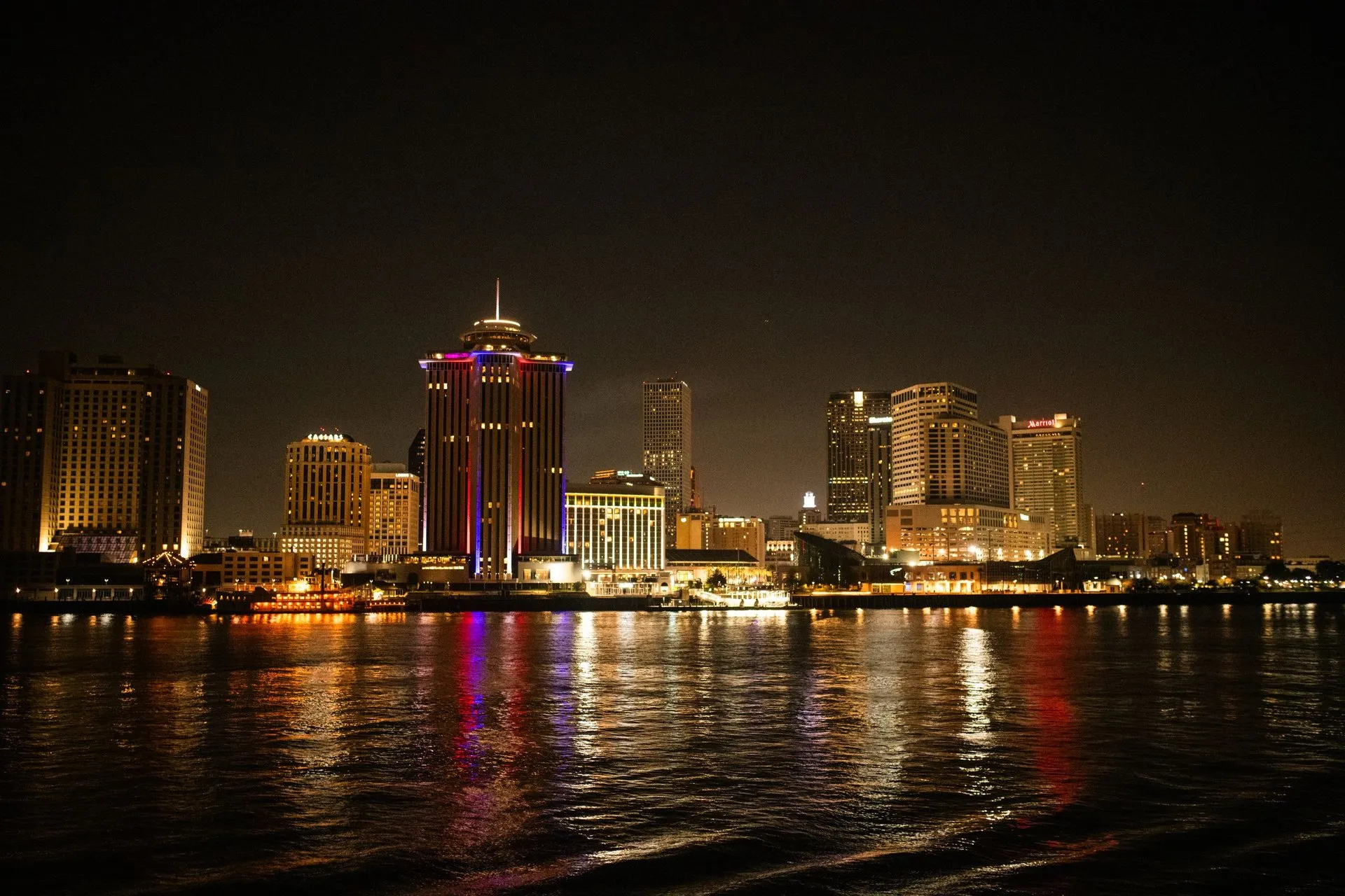 Night shot of New Orleans skyline reflecting on the Mississippi River