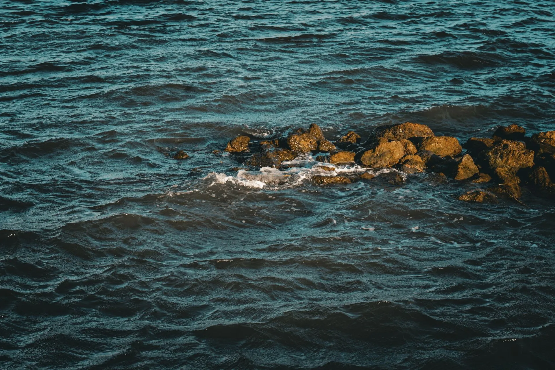 Captured waves crashing on the rocky shoreline of St. Augustine, Florida
